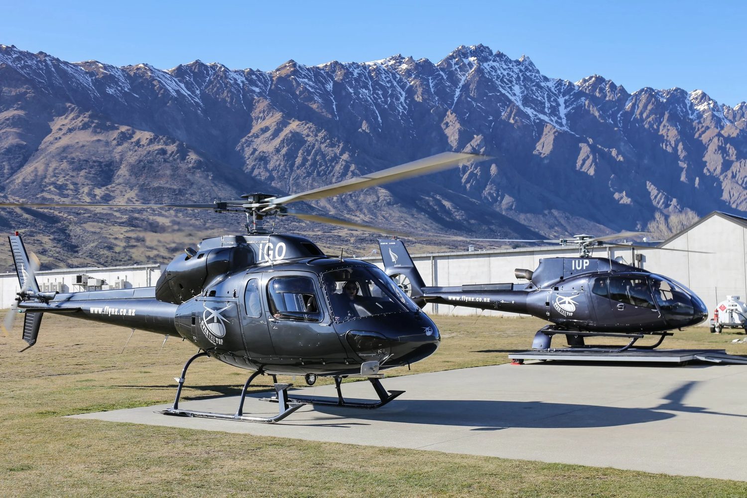 Helicopters lined up on an alpine influencer brand trip