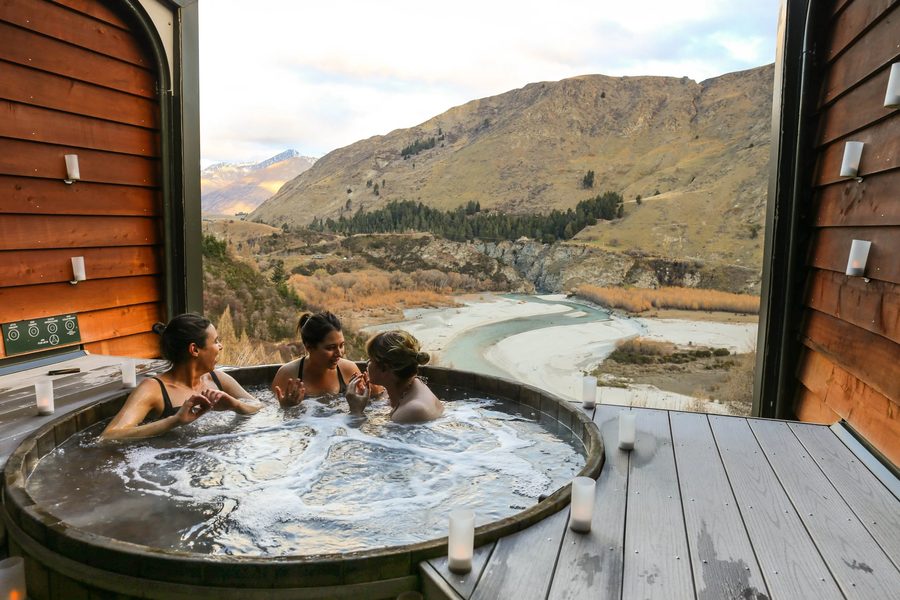 Creators in an alpine hot tub on a brand retreat